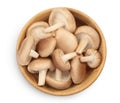 Fresh Shiitake mushroom in a wooden bowl isolated on white background with clipping path. Top view. Flat lay Royalty Free Stock Photo