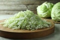 Fresh shredded cabbage on light table, closeup Royalty Free Stock Photo