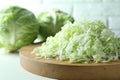 Fresh shredded cabbage on light table, closeup Royalty Free Stock Photo
