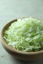 Fresh shredded cabbage on light table, closeup Royalty Free Stock Photo