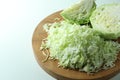 Fresh shredded cabbage on light table, closeup Royalty Free Stock Photo