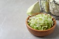 Fresh shredded cabbage on light table. Space for text Royalty Free Stock Photo