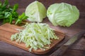 Fresh shredded cabbage on wooden cutting board Royalty Free Stock Photo