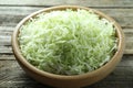 Fresh shredded cabbage on wooden table, closeup Royalty Free Stock Photo