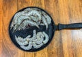 fresh shrimp and cleaned prawns displayed on iron skillet Royalty Free Stock Photo