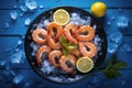 Fresh shrimp with ice in bowl on blue wooden table Royalty Free Stock Photo