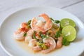 Fresh shrimp on white plate and fresh vegetables, cooked shrimps prawns and seafood spicy chili sauce coriander, cooking shrimp Royalty Free Stock Photo