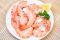 Fresh shrimps served on white plate with parsley lemon , boiled peeled shrimp prawns cooked in the seafood restaurant Royalty Free Stock Photo