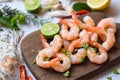 Fresh shrimps served on wooden cutting board in the seafood restaurant, boiled shrimp prawns cooked with herbs and spice Royalty Free Stock Photo