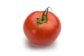 Fresh single tomato isolated on white Royalty Free Stock Photo
