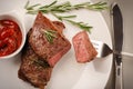 Fresh Sirloin steak on plate, top view