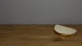 Fresh Slice of Bread on Wooden Table Surface Royalty Free Stock Photo