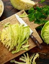 Fresh Slice of Cabbage on wooden chopping board. healthy food Royalty Free Stock Photo