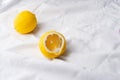 Fresh slice yellow lemon fruit for food on white fabric background