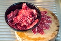 Fresh sliced beef hind shank in black ceramic bowl