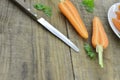 Fresh sliced carrots and knife on wooden table Royalty Free Stock Photo