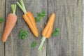 Fresh sliced carrots on wooden background Royalty Free Stock Photo
