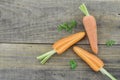 Triangle made of sliced carrots on wooden background Royalty Free Stock Photo