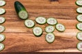 Fresh sliced cucumber on wooden cutting board