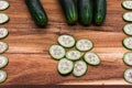 Fresh sliced cucumber on wooden cutting board