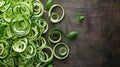Fresh Sliced Cucumbers and Basil on a Wooden Background