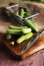 Fresh and sliced cucumbers. Sliced cucumbers on a cutting board. Royalty Free Stock Photo