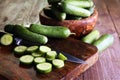 Fresh and sliced cucumbers. Sliced cucumbers on a cutting board. Royalty Free Stock Photo