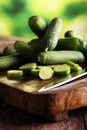 Fresh and sliced cucumbers. Sliced cucumbers on a cutting board. Royalty Free Stock Photo