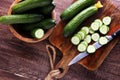 Fresh and sliced cucumbers. Sliced cucumbers on a cutting board. Royalty Free Stock Photo