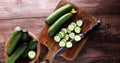 Fresh and sliced cucumbers. Sliced cucumbers on a cutting board. Royalty Free Stock Photo