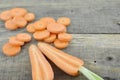 Fresh sliced and double cut carrots on wooden table Royalty Free Stock Photo