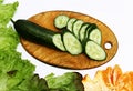 Fresh sliced green cucumber on a wooden board. Coooking salad. Diet food Royalty Free Stock Photo