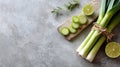 Fresh sliced leeks and limes on stone surface with herb garnish Royalty Free Stock Photo