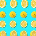 Fresh sliced lemon pattern on blue background. Top view. Colorful concept healthy and vegan image Royalty Free Stock Photo