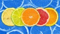 Fresh sliced mixed citrus fruits background Royalty Free Stock Photo