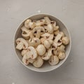 Fresh sliced mushrooms in a round porcelain bowl Royalty Free Stock Photo