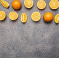 Fresh sliced oranges granite background, Border, place for text Royalty Free Stock Photo