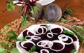 Fresh sliced organic beetroot with onion decorated on a white plate Royalty Free Stock Photo