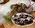 Fresh sliced organic beetroot with onion decorated on a white plate Royalty Free Stock Photo