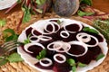 Fresh sliced organic beetroot with onion decorated on a white plate Royalty Free Stock Photo