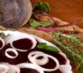 Fresh sliced organic beetroot with onion decorated on a white plate Royalty Free Stock Photo