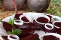 Fresh sliced organic beetroot with onion decorated on a white plate Royalty Free Stock Photo