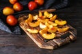 Fresh sliced peaches on wooden board Royalty Free Stock Photo