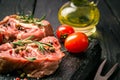 Fresh sliced raw meat on a wooden cutting board