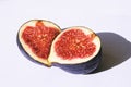 Fresh sliced ripe figs on white. Halves of fruit Royalty Free Stock Photo