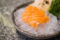 Fresh sliced salmon or salmon sashimi on ice in bowl set on table, Japanese food Royalty Free Stock Photo