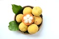 Close up fresh sliced santol Sandoricum koetjape fruit in a Wicker basket.the famous fruit Thailand and seasonal fruit