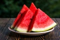 Fresh sliced watermelon wooden background Royalty Free Stock Photo