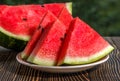 Fresh sliced watermelon wooden background Royalty Free Stock Photo