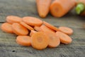 Fresh slices carrot on wooden table, closeup Royalty Free Stock Photo